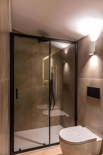 a bathroom with a shower with a toilet at Luxury terrazza in Bari