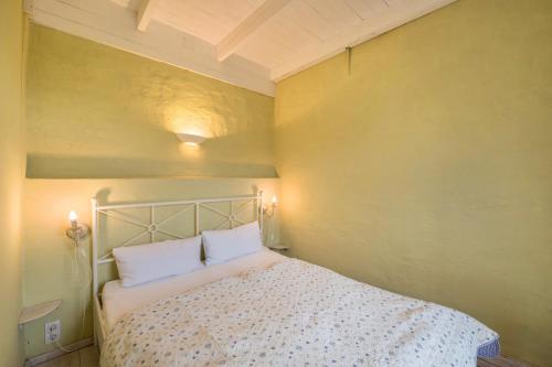 a bedroom with a bed with two pillows on it at Ferienhaus Sommerhaus Julin in Saal