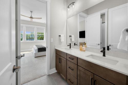 a bathroom with two sinks and a large mirror at Paddle Pointe in Sherrills Ford