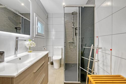 a bathroom with a sink and a shower at Ayora in Jávea