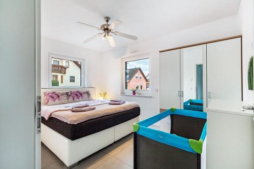 a bedroom with a king sized bed and a bathtub at Ferien Marx in Oberbrechen