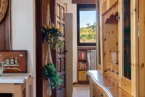 a hallway with a door and a window in a room at L'attico Con Terrazza Vista Lago in Laveno-Mombello
