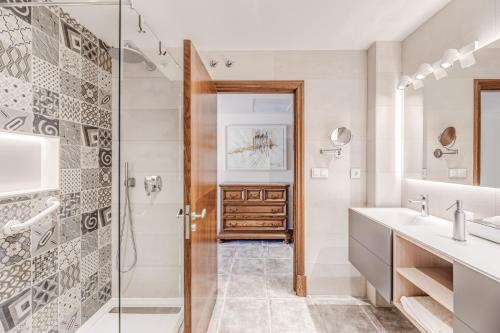a bathroom with a shower and a sink at Casa Del Pinaret in Port de Pollensa