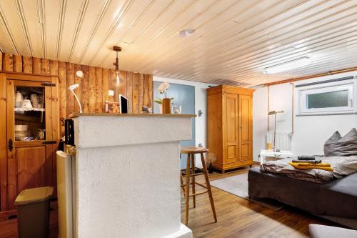 a room with a kitchen and a living room at Sleep And Go in Mundelsheim