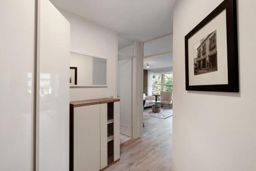 a living room with a hallway with white walls at Sonnenterrasse im Schwarzwald in Freudenstadt