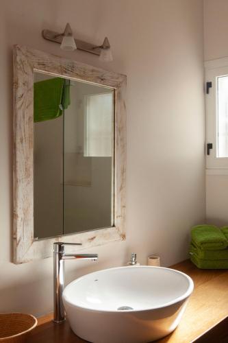 a bathroom with a large white sink and a mirror at Vivendes Adelina - Escapada Formentera in Es Pujols