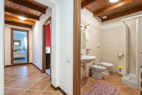 a bathroom with a toilet and a sink at Villa Mavi in Quartucciu