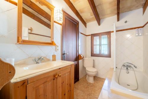 a bathroom with a sink and a toilet at S' Oratge in Islas Baleares
