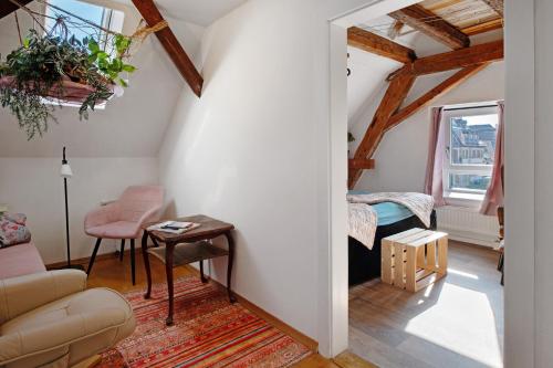 a living room with a couch and a table at Ferienappartments Nähe Schweiz in Kandern