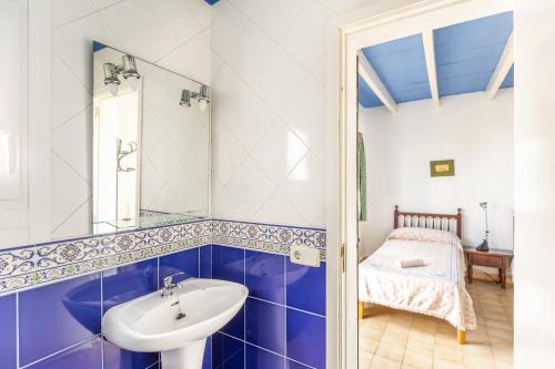 a bathroom with a sink and a mirror at Cala Serena Beach in Felanitx