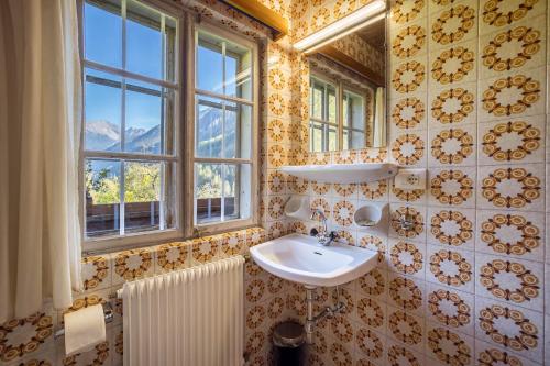 a bathroom with a sink and a window at Ferienhaus Oberschneider in Selva dei Molini