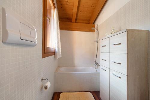 a small bathroom with a toilet and a sink at Magic moment in Lake Como in Perledo