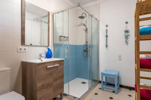a bathroom with a shower and a sink at Cas Cover in Santa Margalida
