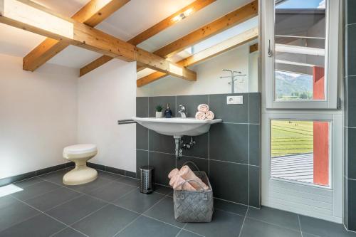a bathroom with a sink and a toilet at Suite Marianne in Valdaora