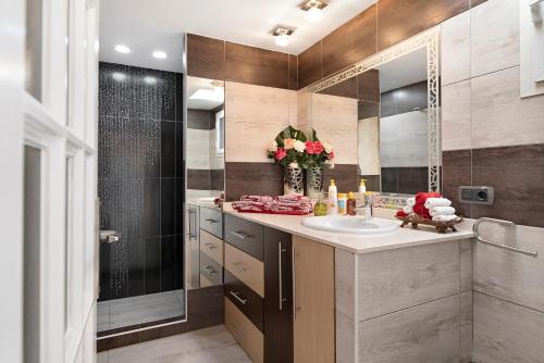 a bathroom with a sink and a mirror at Isla Lobos in Playa Blanca