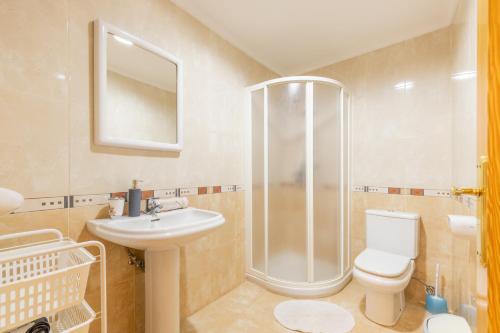 a bathroom with a shower and a toilet and a sink at Tosca Mar 223 in Moraira