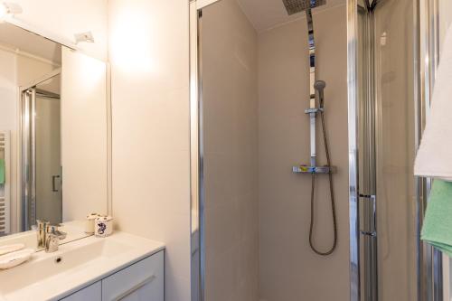 a bathroom with a shower and a sink at 2 pièces face océan, Lacanau in Lacanau