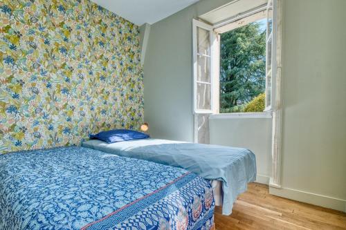 Llit o llits en una habitació de Les Orchidées