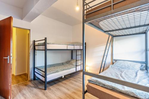 two bunk beds in a room with a hallway at Haci Babas Home in Bestwig