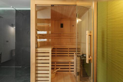 a closet with wooden shelves and a glass door at Mas de la Tata in Rabbi