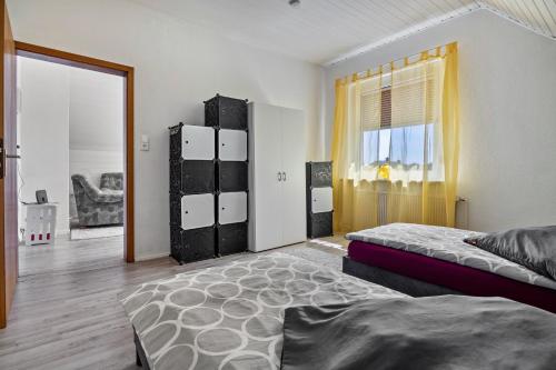 a bedroom with two beds and a window at Haus Elseaue in Bünde