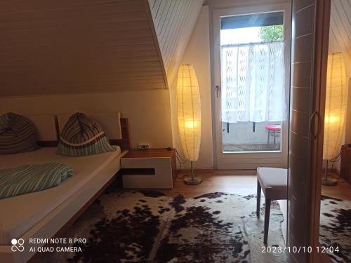 a small bedroom with a bed and a window at Apartement Jörg in Lana