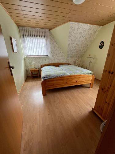 a bedroom with a bed in a attic at Ferienwohnung Heinz Romes in Wimbach