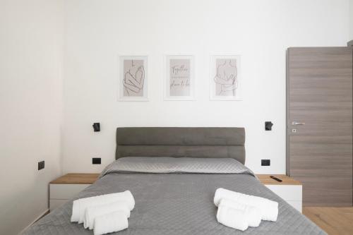a bedroom with a bed with two white pillows at Il Filo Azzurro Ulassai in Ulassai