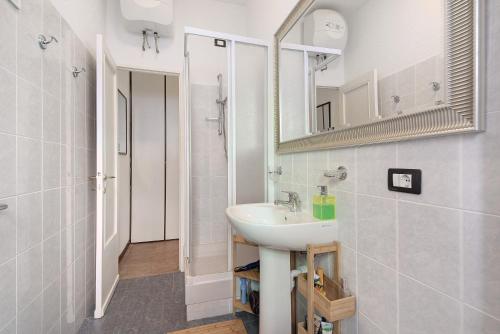 a bathroom with a sink and a mirror at Casa Nio in Rapallo