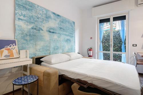 a bedroom with a bed and a window at Casa Nio in Rapallo
