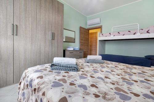 a bedroom with a bed and a bunk bed at Loano Home in Loano