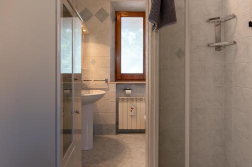 a bathroom with a sink and a shower at Casa Isidora in Acquaviva