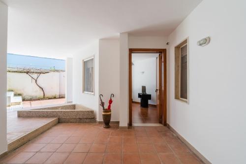 a hallway of a house with an open door at Casa Fortuna in Gallipoli