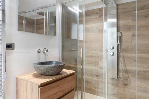 a bathroom with a sink and a shower at Railway Loft Dimaro I By Immobilux in Monclassico