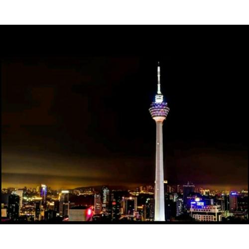 a view of the space needle at night at Stella Maison KLCC in Kuala Lumpur