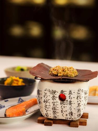 a bowl of food with a spatula on top of it at Nakaodaira in Takayama