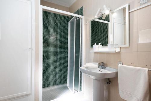 a bathroom with a shower and a sink and a shower at Villa Montenmedio 2 in El Soto