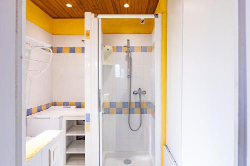 a bathroom with a shower and a sink at Marina de Sant Ambroggio in Lumio