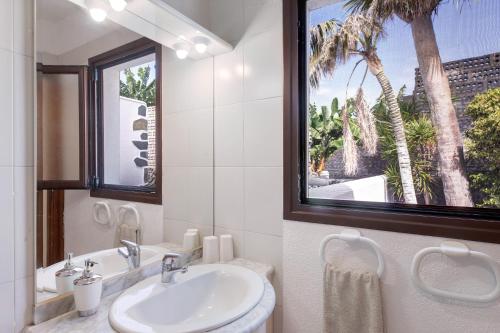 a bathroom with a sink and a window at Moijama 4 in Los Llanos de Aridane