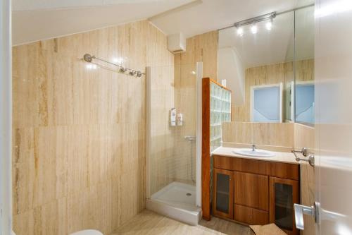 a bathroom with a shower and a sink and a toilet at Bahia Meloneras Luxury Duplex in Maspalomas