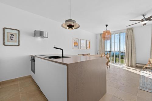 a kitchen with white walls and a counter top at Casa Maria Luisa in Manilva
