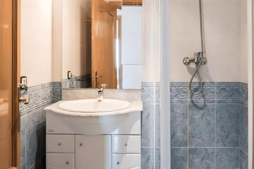 a bathroom with a sink and a shower at Villa Granvista by Easy Brava in Calonge