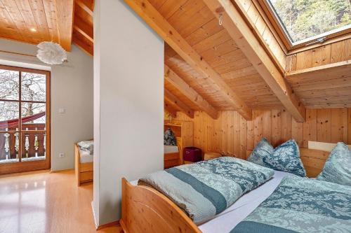 a bedroom in a house with a large window at Ebnichers Paradies in Cardano