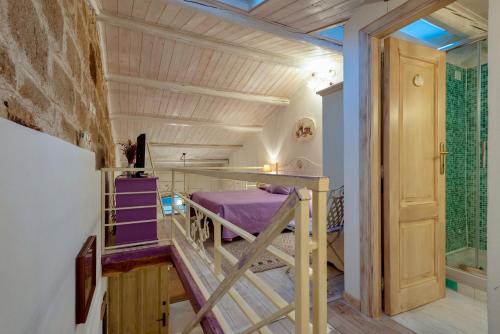 a bedroom with a bunk bed in a room at Alghero Old Town Gem - Sardinia in Alghero