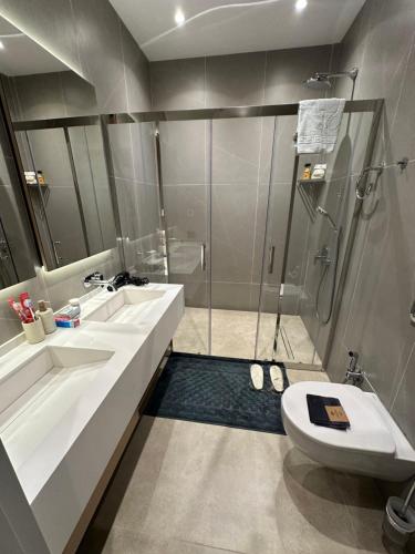 a bathroom with a shower and a toilet and a sink at Sea Breeze, Polo Residence, Baku, MR in Nardaran
