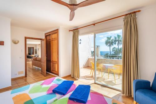 a bedroom with a bed and a view of the ocean at Pedrassa Gran Superior in Cala Santanyi