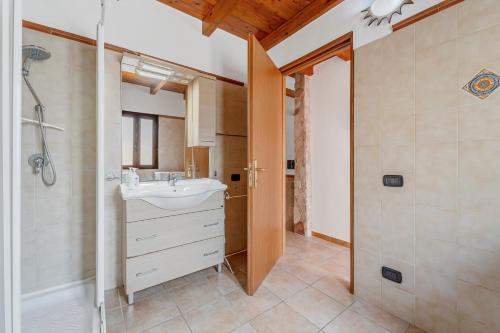 a bathroom with a sink and a shower at Casa rustica in Gonnesa