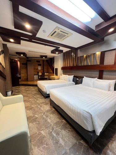 a hotel room with two beds at Hola Hotel in Can Tho