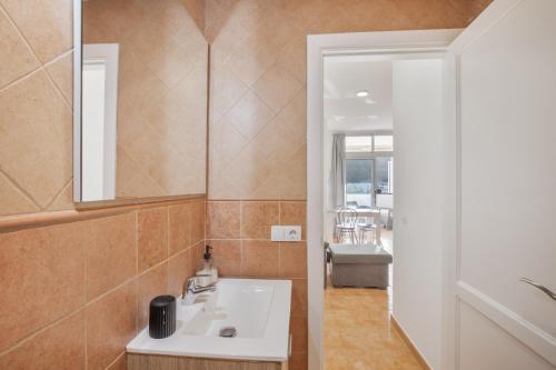 a bathroom with a sink and a mirror at Vv Velero in Puerto de Mogán