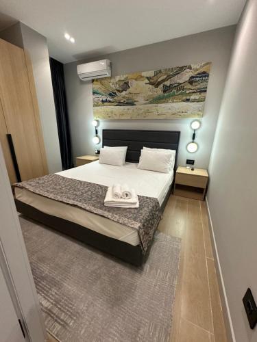 a bedroom with a bed with a towel on it at Sea Breeze, Polo Residence, Baku, MR in Nardaran